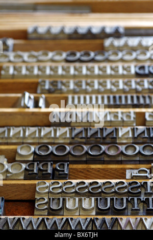 Hot metal types in wooden printers typecase. Stock Photo