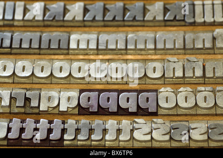 Hot metal types in wooden printers typecase. Stock Photo