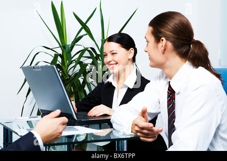 Photo of secretary and her colleague communicating during work Stock Photo