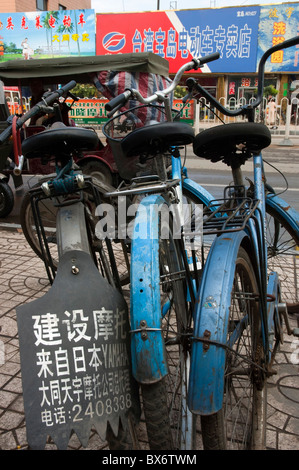 License plate on a parked bicycle lined up along a city street in Datong, Shanxi, China.