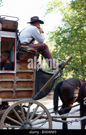 A stagecoach stopped while passengers get on board. Columbia State Historic Park, Columbia, Tuolumne County, California, U.S.A. Stock Photo