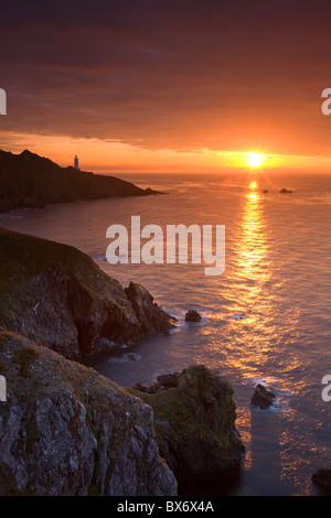 Spectacular sunrise behind Start Point Lighthouse in South Hams, Devon, England. Autumn (September) 2010. Stock Photo