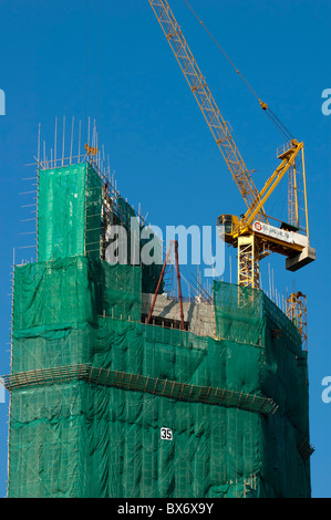 Bamboo scaffolding used for the construction of a skyscraper, Kowloon, Hong Kong, China. Stock Photo