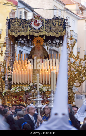 Religious float being carried through the streets during Semana Santa (Holy Week) celebrations, Malaga, Andalucia, Spain, Europe Stock Photo