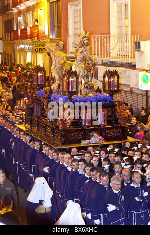 Religious float being carried through the streets during Semana Santa (Holy Week) celebrations, Malaga, Andalucia, Spain, Europe Stock Photo