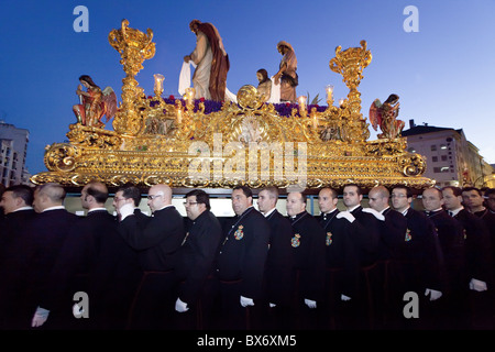 Religious float being carried through the streets during Semana Santa (Holy Week) celebrations, Malaga, Andalucia, Spain, Europe Stock Photo