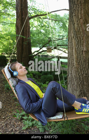 Young man relaxing in hammock Stock Photo
