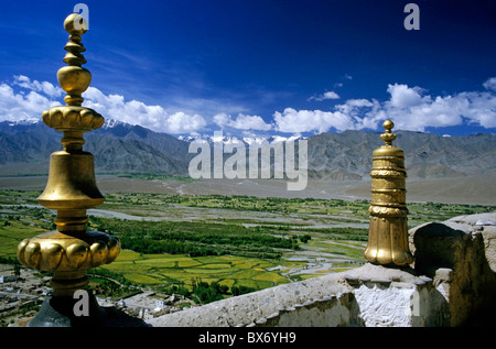 Gold sculptures on walls of the Thikse Gompa Tibetan Monastery with scenic view of mountains in the background, Ladakh, India. Stock Photo