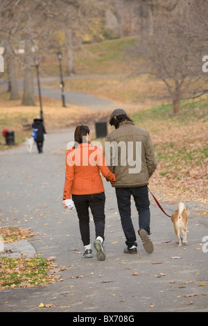 Young couple take a walk on a brisk autumn day through Prospect Park; Brooklyn; New York. Stock Photo