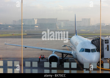 A passenger jet during early morning. Ninoy Aquino International Airport in Manila, Philippines. Asia