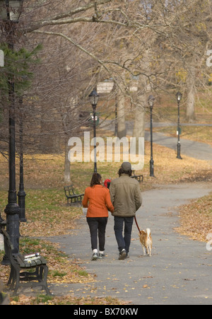 Young couple take a walk on a brisk autumn day through Prospect Park; Brooklyn; New York. Stock Photo