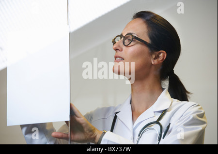 Doctor looking at a file Stock Photo