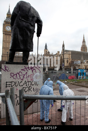 Aftermath of student demonstration in Parliament Square, London: police forensics team at work Stock Photo