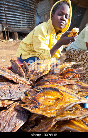 Fish vendor in the Kibera slums, Nairobi, Kenya Stock Photo