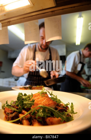 The Chef Stephen Terry adds a garnish and dressing to a fish meal at The Hardwick near Abergavenny 2008 Stock Photo