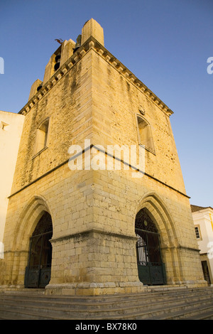 The fortress like stone tower of medieval Faro Cathedral (Largo da Se) in Faro, Algarve, Portugal, Europe Stock Photo
