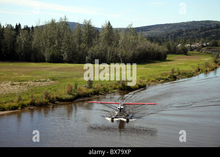 Float plane, seaplane take off on river in Chena, Alaska, USA. Stock Photo