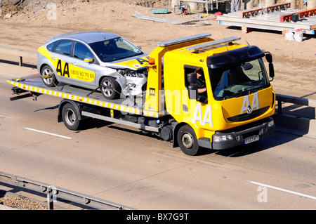 AA breakdown recovery truck loaded with 4x4 on M25 Motorway Stock Photo ...