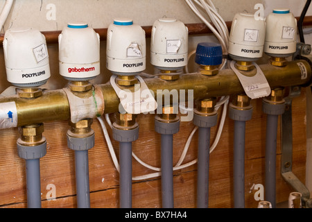 Underfloor Central Heating pipes underfloor installation, Control Valves, pump layout systems,  Insulated new plumbling pipework. Stock Photo