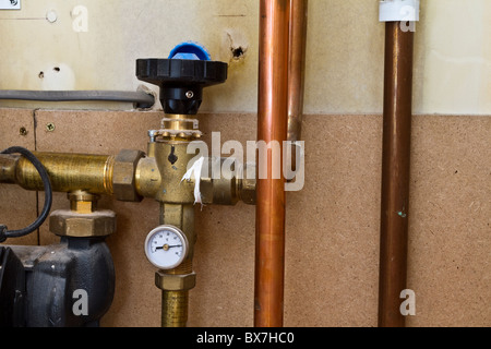 Underfloor Central Heating pipes underfloor installation, Control Valves, pump layout systems,  Insulated new plumbling pipework. Stock Photo