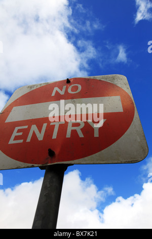 No entry sign in front of light cloudy sky. Stock Photo