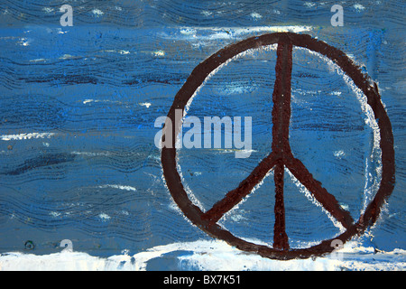 Peace sign painted on wooden board. Stock Photo