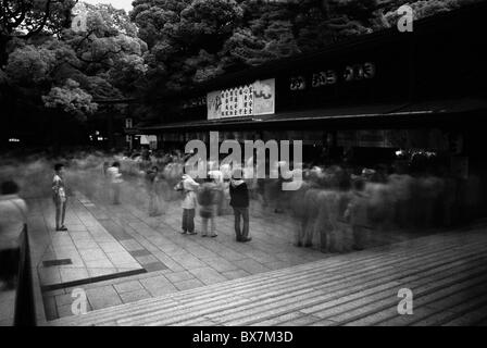 long exposure of masses going through meiji jingu shrine in tokyo during new year's shogatsu celebrations, japan Stock Photo