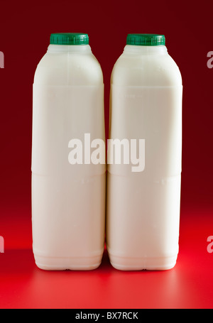 Two two pint plastic containers of Green top semi skilled milk Stock Photo