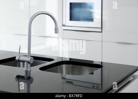kitchen faucet and oven modern black and white interior design Stock Photo