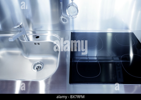 Kitchen silver sink and vitroceramic stove hob modern decoration Stock Photo