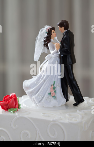 Wedding cake and topper with couple dancing Stock Photo