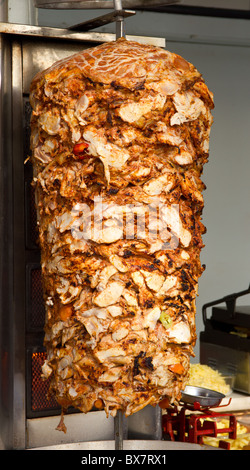 Chicken Cooking on Rotating Vertical Spit for Turkish Doner Kebab Stock Photo