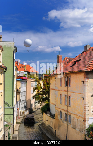 Hot air balloon over a the Chertovka River, a small tributary off the Vltava River, in Prague, Czech Republic. Stock Photo