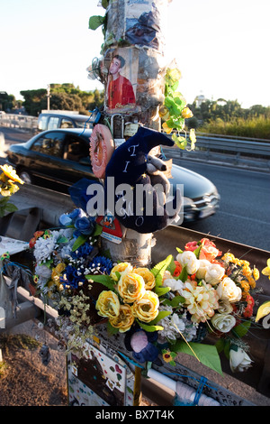 Flowers on roadside ground of  Rome Italy street, as memorial of fatal accident victim. Stock Photo