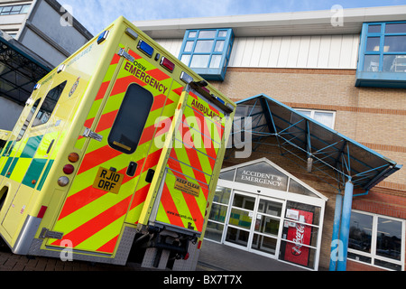 Emergency ambulance parked outside hospital accident and emergency entrance Stock Photo