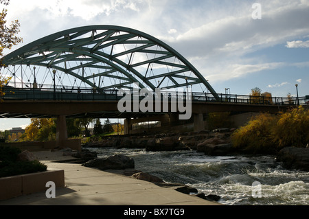 A bridge allows Speer Blvd to cross over the Platte river in downtown Denver. Stock Photo