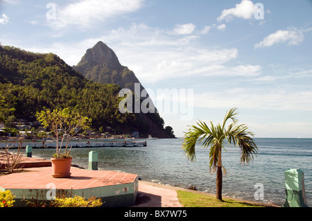 garden in Waterfront Park Soufriere St. Lucia with view of famous twin peak piton mountains Caribbean sea Stock Photo