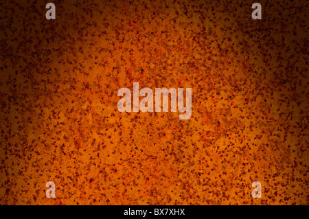 Corroded rusty metal surface lit dramatically from above Stock Photo