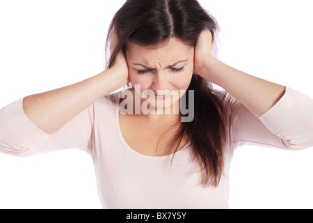 Attractive young woman suffering from tinnitus. All isolated on white background. Stock Photo