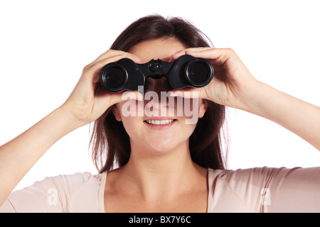 Attractive young woman using spyglasses. All isolated on white background. Stock Photo