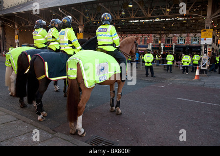 Police and mounted police guard ahead of a protest march by the English Defence League EDL in Preston Lancashire Stock Photo