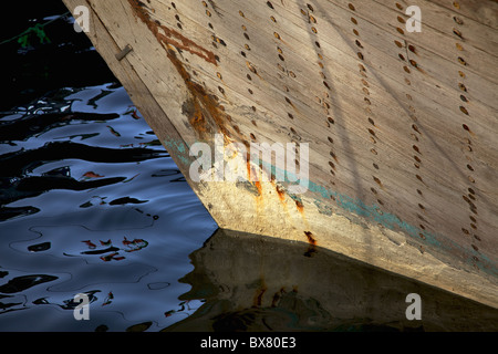 The bow of a traditional wooden trading dhow moored in Dubai Creek, UAE. Stock Photo