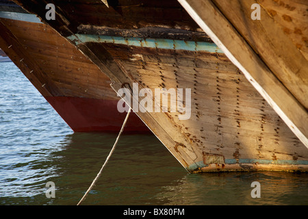 The bows of traditional wooden trading dhows moored in Dubai Creek, UAE. Stock Photo