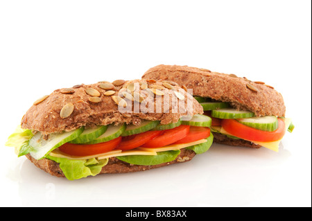 Healthy lunch with brown wholemeal bread rolls with cereals and vegetables Stock Photo