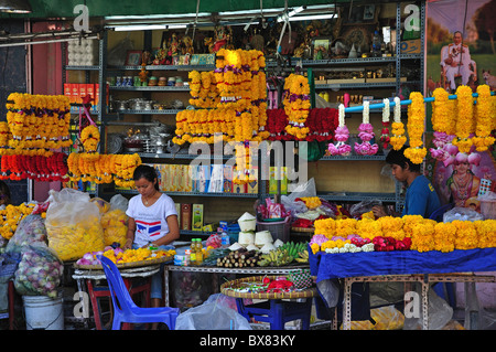 Garlands of flowers for sale, Silom, Bang Rak District, Bangkok, Thailand Stock Photo