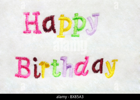 colorful Happy Birthday greeting embroidery on white Stock Photo