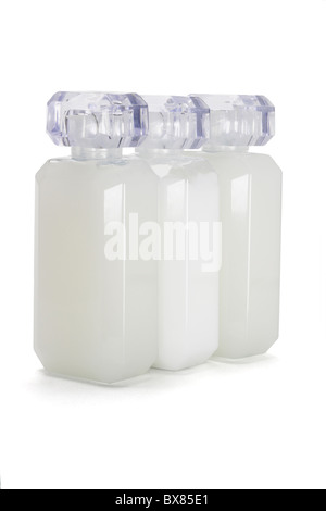 Three glass bottles of toiletries on white background Stock Photo