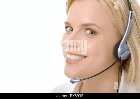 Portrait of friendly customer service operator smiling with charming confident smile Stock Photo