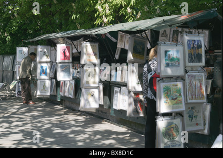 Book stalls of Les Bouquinistes selling books and art prints on Quai de Montebello on the left bank in Paris, France. Stock Photo