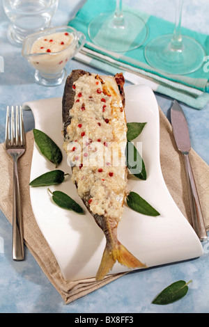 Grilled horse mackerel with almonds sauce. Recipe available. Stock Photo